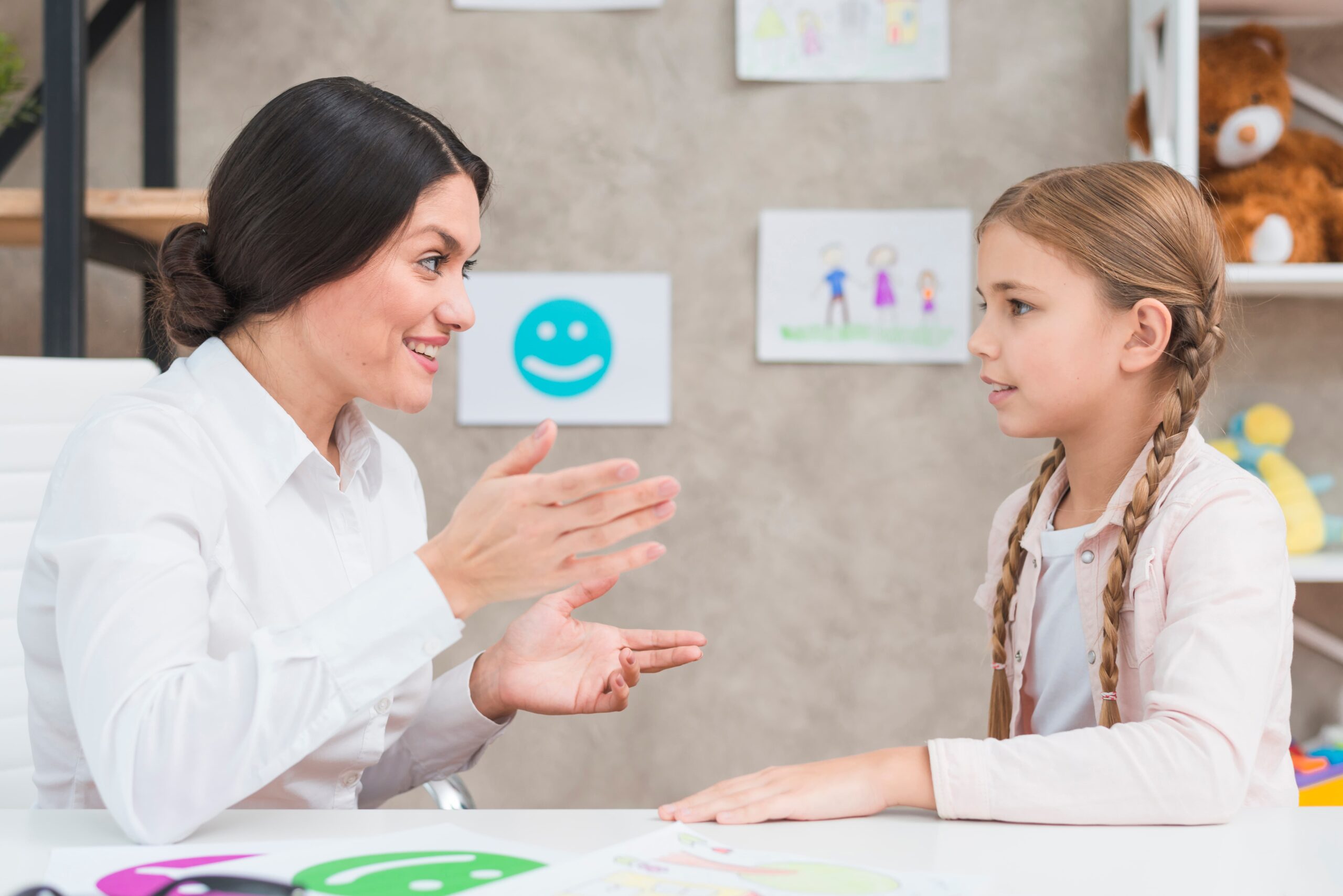smiling portrait girl female psychologist having conversation office 1 scaled