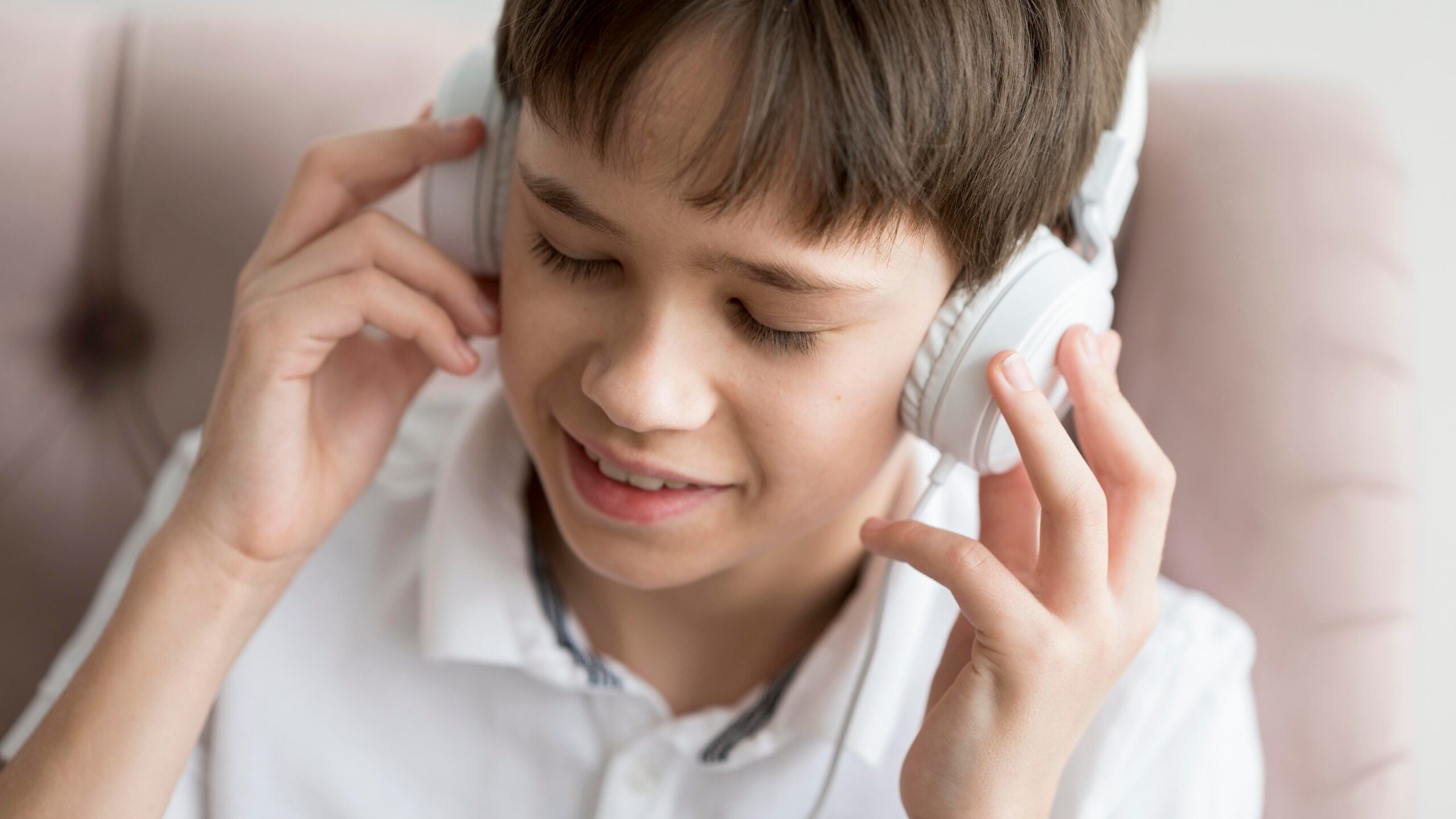young boy with headphones 1 scaled